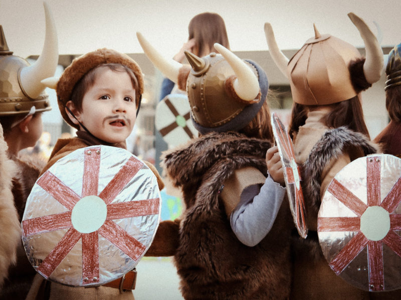 children with Viking costumes in a show at the school
